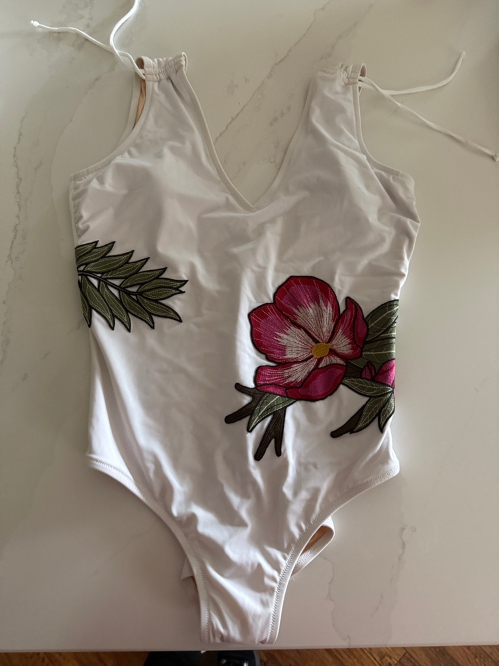 White One-Piece Swimsuit with Pink Floral Appliqué